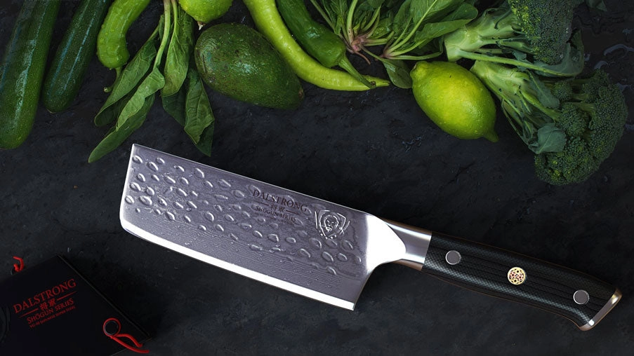 A Dalstrong Nakiri knife cutting vegetables